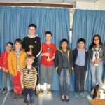 Groupe de jeunes joueurs posant avec leurs coupes à l'étape de Gif du Grand Prix Jeunes de l'Essonne.